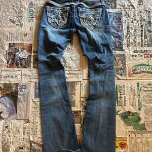 Rock Revival Women's Mid-Rise Bootcut Jeans with Embellished Pockets size 25